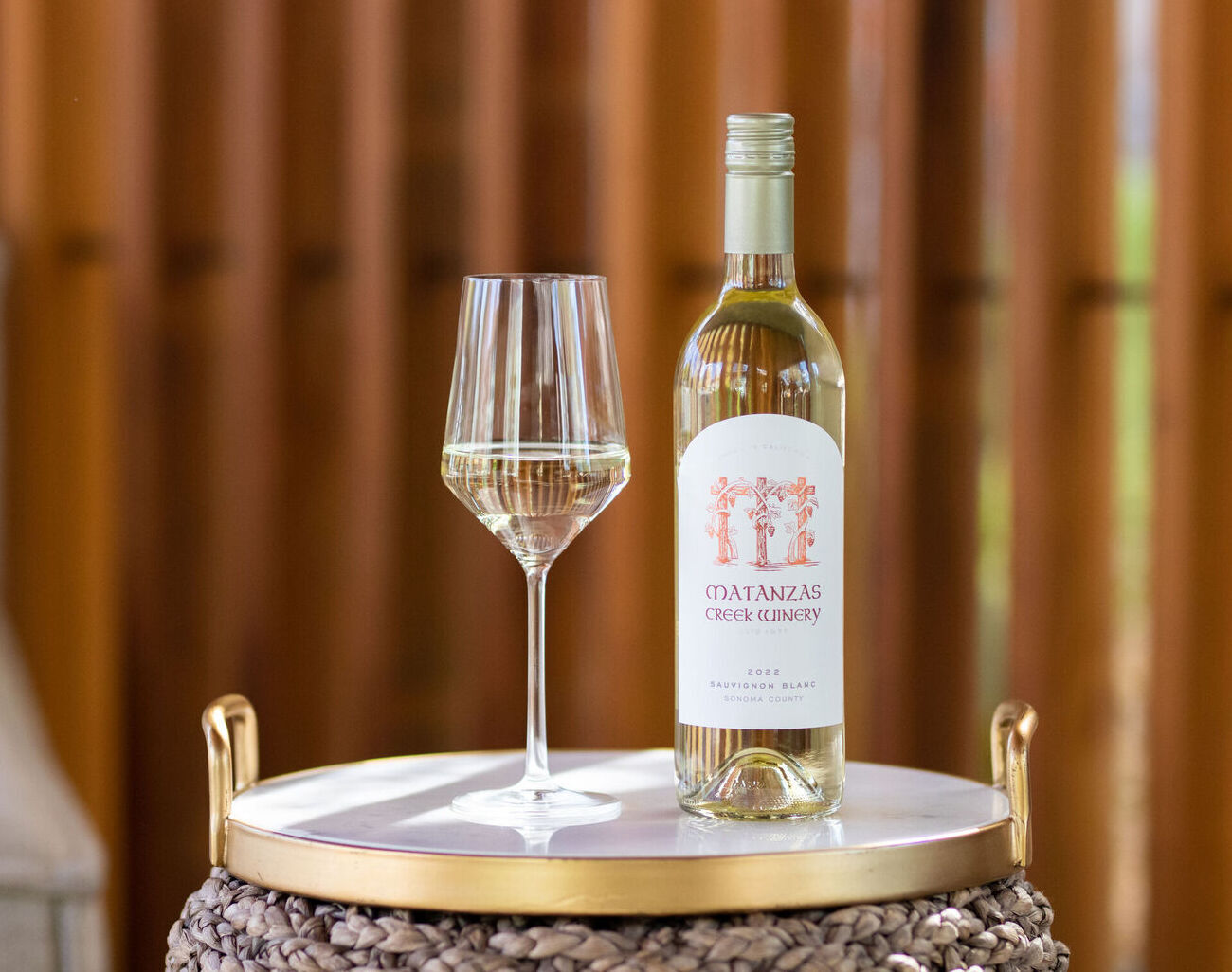 A glass and bottle of wine of Matanzas Creek Sauvignon Blanc